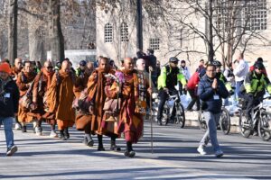 Bhikkhu Paññakāra leads a procession of Buddhist monks walking along Massachusetts Avenue at Fulton Street NW in Washington, D.C., as part of the “Walk for Peace.” (Source: Wikimedia Commons) Bhikkhu Paññakāra leads a procession of Buddhist monks walking along Massachusetts Avenue at Fulton Street NW in Washington, D.C., as part of the “Walk for Peace.”(Source: Wikimedia Commons)